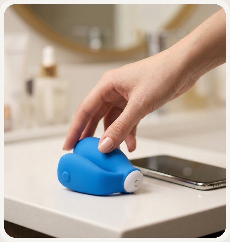Hand touching a kGoal device on a countertop